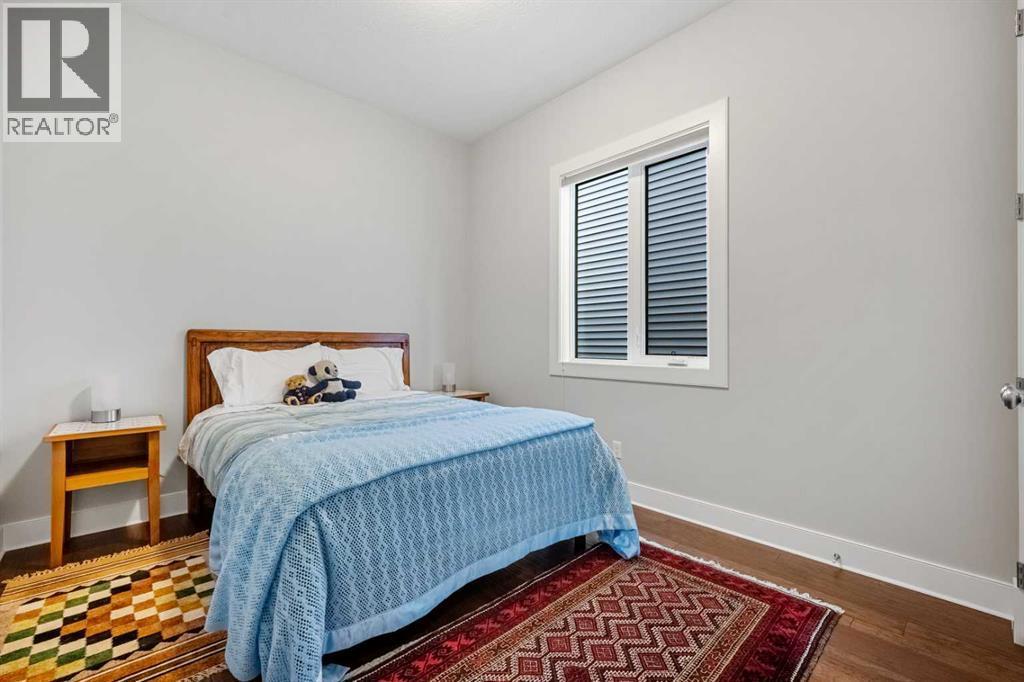 You have an additional guest bedroom on the main level - 2253 Bayside Road Sw, Airdrie, AB - Indoor Photo Showing Bedroom