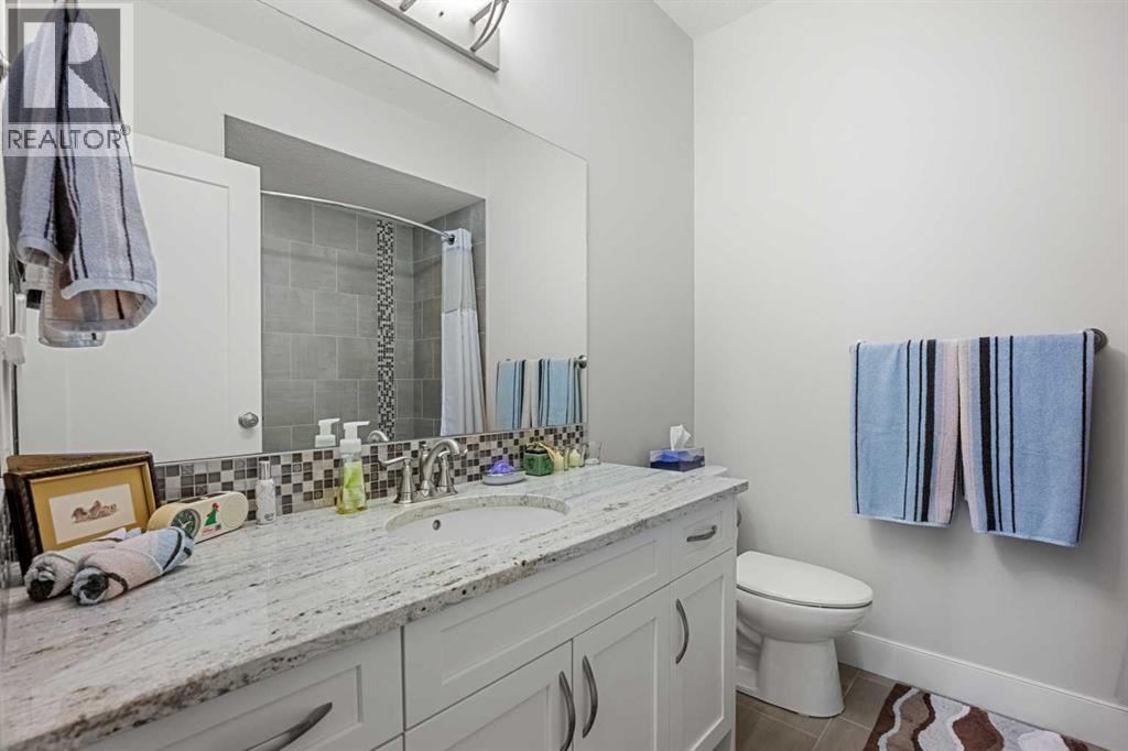 An additional four piece guest bathroom located in the basement - 2253 Bayside Road Sw, Airdrie, AB - Indoor Photo Showing Bathroom