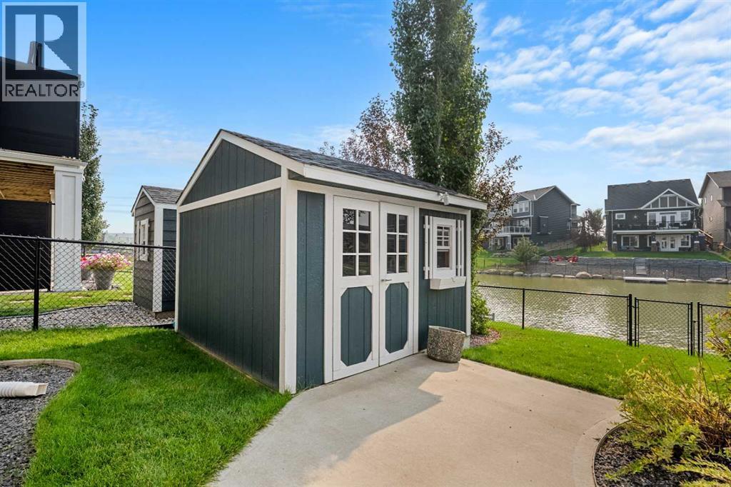 The backyard comes completed with a shed - 2253 Bayside Road Sw, Airdrie, AB - Outdoor