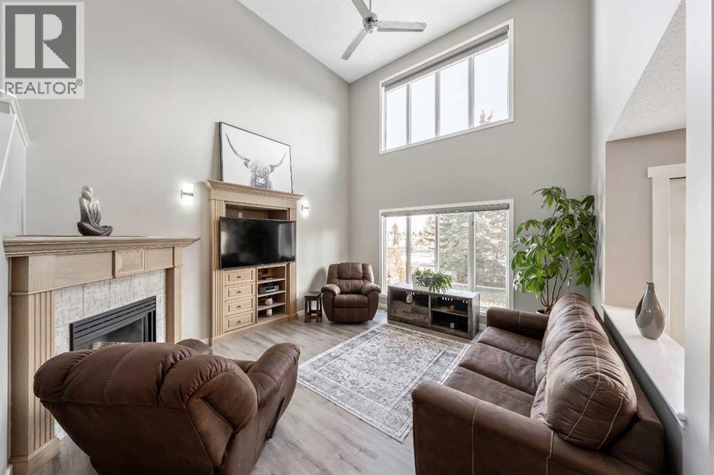 Living Room - 9 Hidden Valley Crescent Nw, Calgary, AB - Indoor Photo Showing Living Room With Fireplace