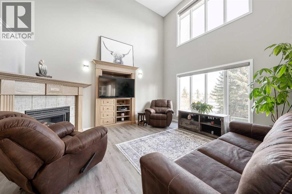 9 Hidden Valley Crescent Nw, Calgary, AB - Indoor Photo Showing Living Room With Fireplace