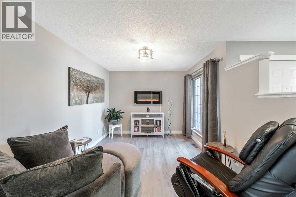 9 Hidden Valley Crescent Nw, Calgary, AB - Indoor Photo Showing Living Room With Fireplace