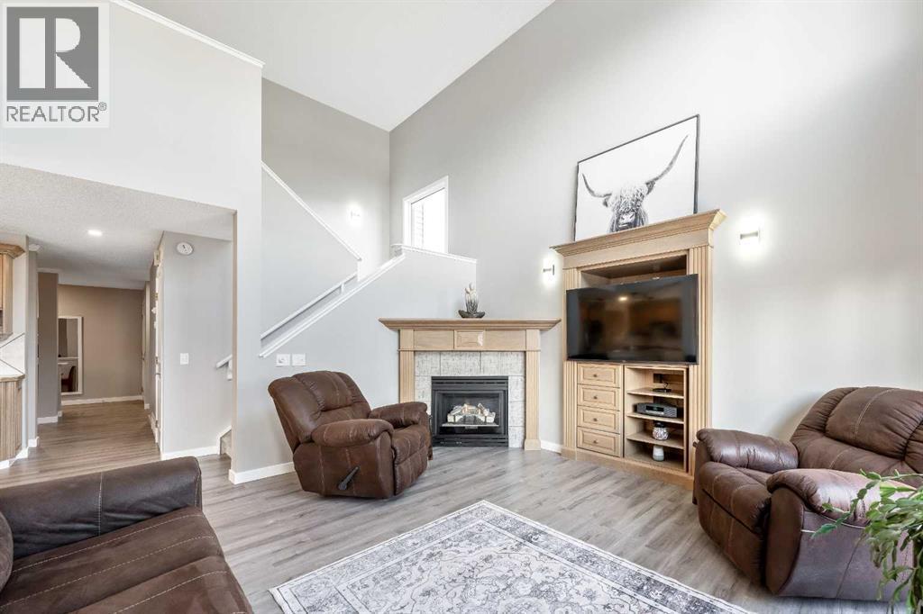 9 Hidden Valley Crescent Nw, Calgary, AB - Indoor Photo Showing Living Room With Fireplace