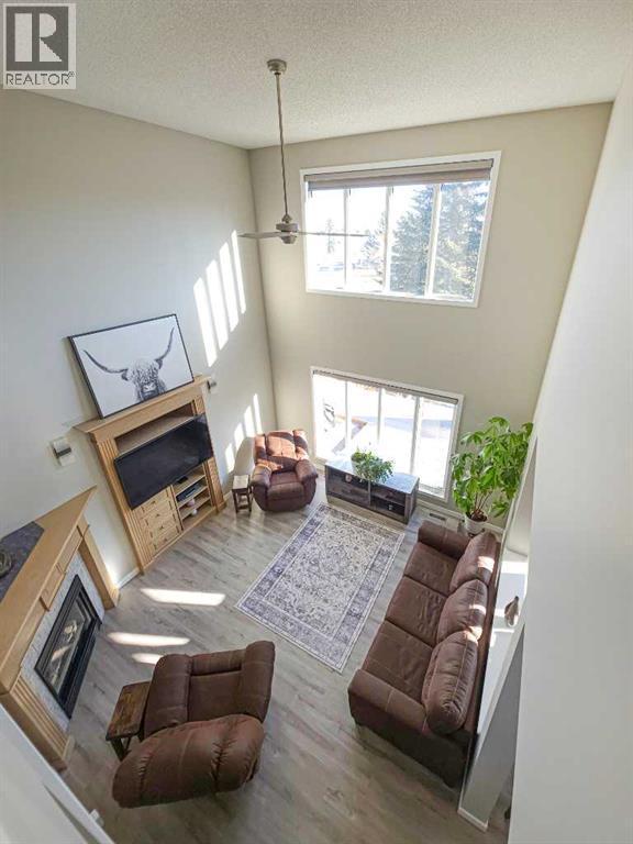 View from 2nd Level - 9 Hidden Valley Crescent Nw, Calgary, AB - Indoor Photo Showing Living Room With Fireplace