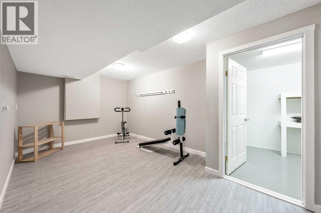 Flex Room basement - 9 Hidden Valley Crescent Nw, Calgary, AB - Indoor Photo Showing Gym Room