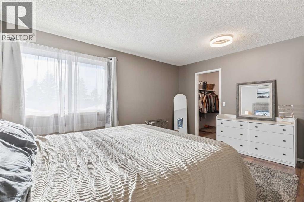 205 Acacia Drive Se, Airdrie, AB - Indoor Photo Showing Bedroom