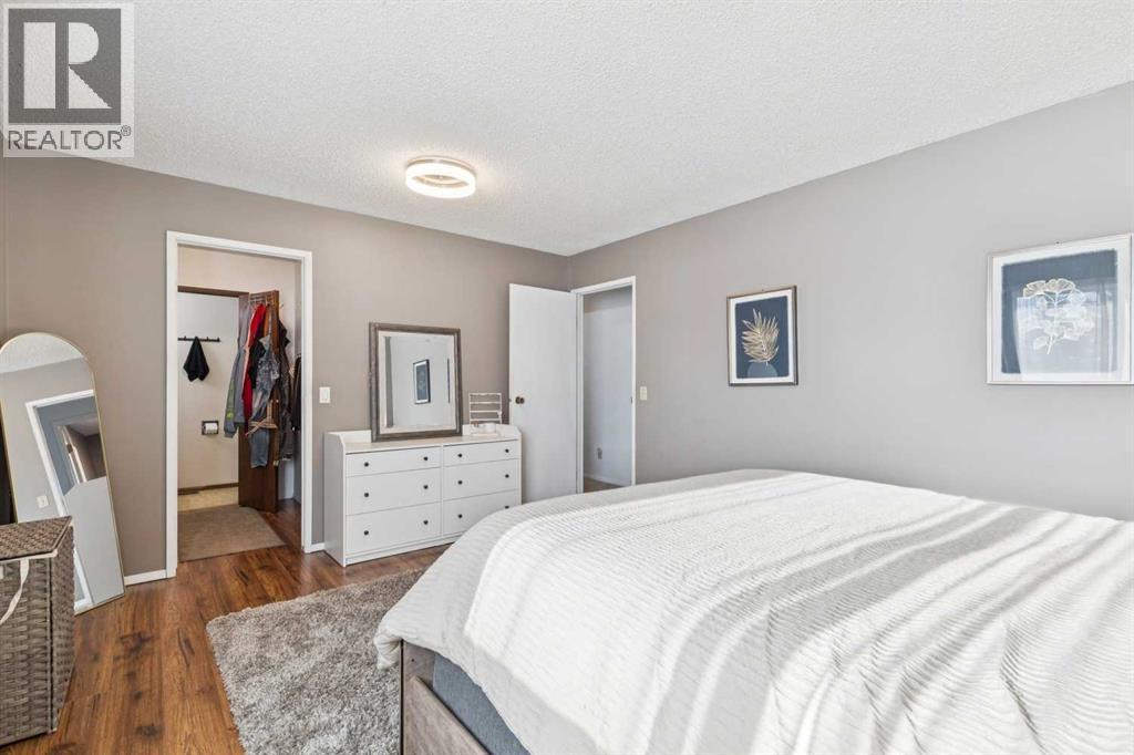 205 Acacia Drive Se, Airdrie, AB - Indoor Photo Showing Bedroom