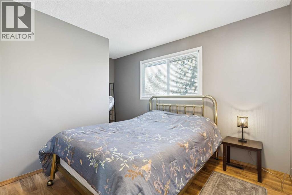 205 Acacia Drive Se, Airdrie, AB - Indoor Photo Showing Bedroom