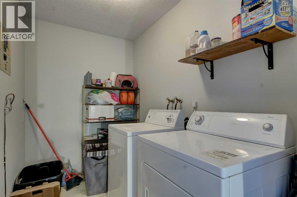 Laundry room on main floor - 602, 2200 Woodview Drive Sw, Calgary, AB - Indoor Photo Showing Laundry Room