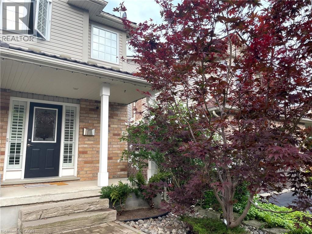 Doorway to property featuring a porch and brick siding - 443 Lausanne Crescent, Waterloo, ON - Outdoor With Deck Patio Veranda