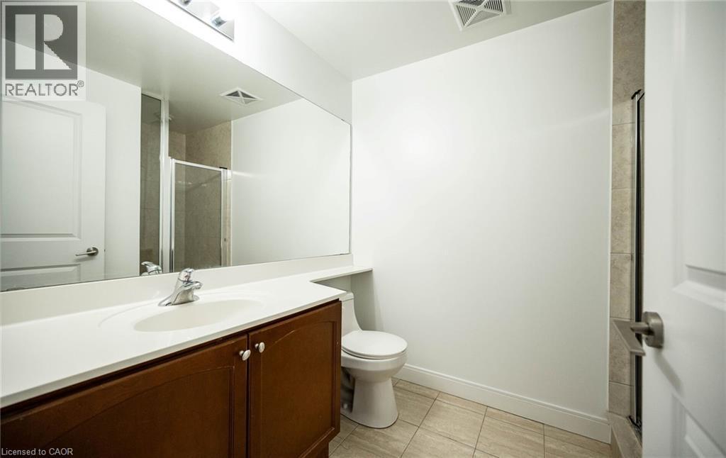 Full bath featuring vanity and a stall shower - 50 Absolute Avenue Unit# 2105, Mississauga, ON - Indoor Photo Showing Bathroom