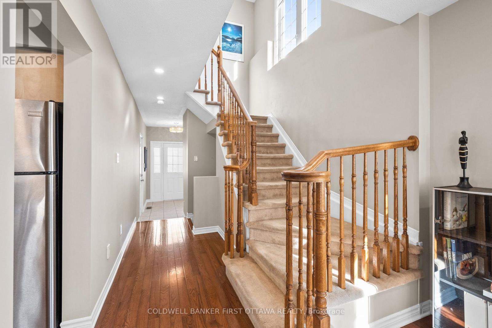 Stairs up to second level w vertical window. - 20 Fieldberry Private, Ottawa, ON - Indoor Photo Showing Other Room