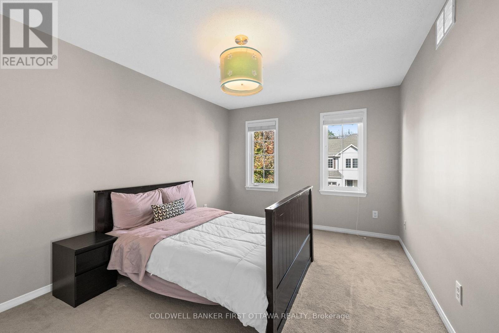 Bedroom w fixture above, facing North - 20 Fieldberry Private, Ottawa, ON - Indoor Photo Showing Bedroom