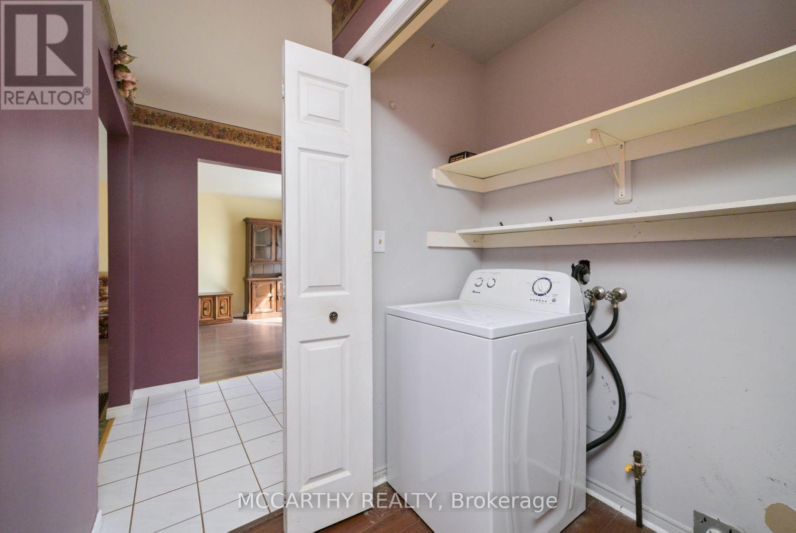 Main Floor laundry with New Dryer in place - 28 Wilson Crescent, Southgate, ON - Indoor Photo Showing Laundry Room