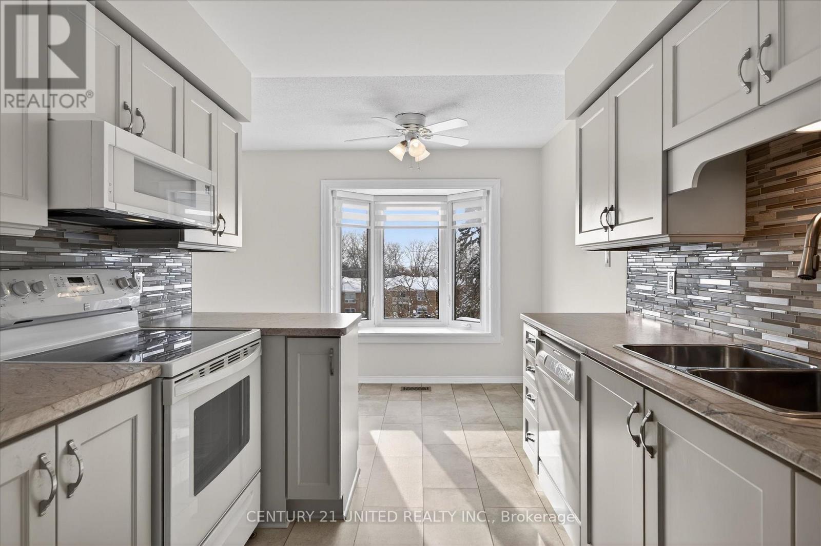 214A - 1099 Clonsilla Avenue, Peterborough (Otonabee Ward 1), ON - Indoor Photo Showing Kitchen With Double Sink