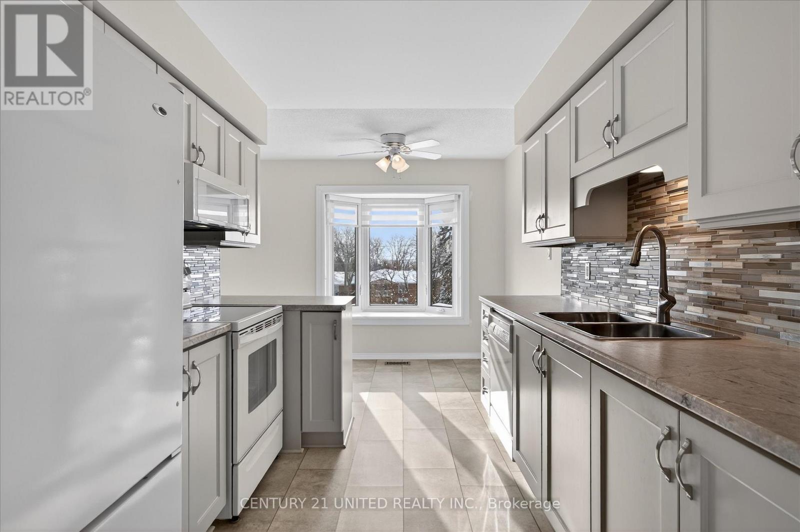 214A - 1099 Clonsilla Avenue, Peterborough (Otonabee Ward 1), ON - Indoor Photo Showing Kitchen With Double Sink With Upgraded Kitchen