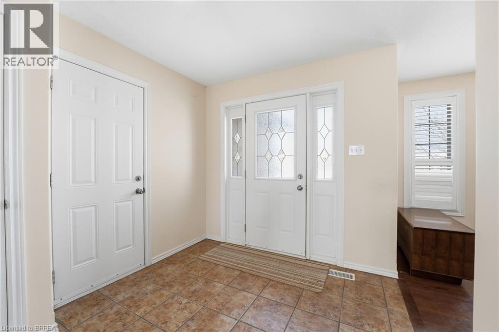 Entryway featuring baseboards and tile patterned floors - 28 Mansfield Drive, St. George, ON - Indoor Photo Showing Other Room