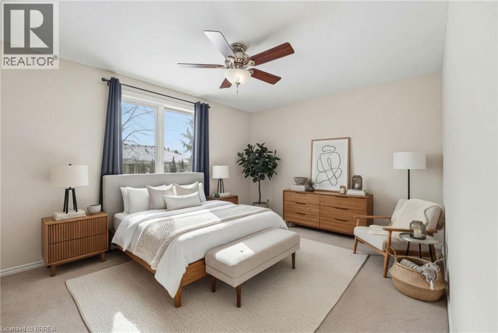 Carpeted bedroom featuring ceiling fan - 28 Mansfield Drive, St. George, ON - Indoor Photo Showing Bedroom