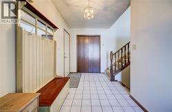 Entryway with stairway and a chandelier -