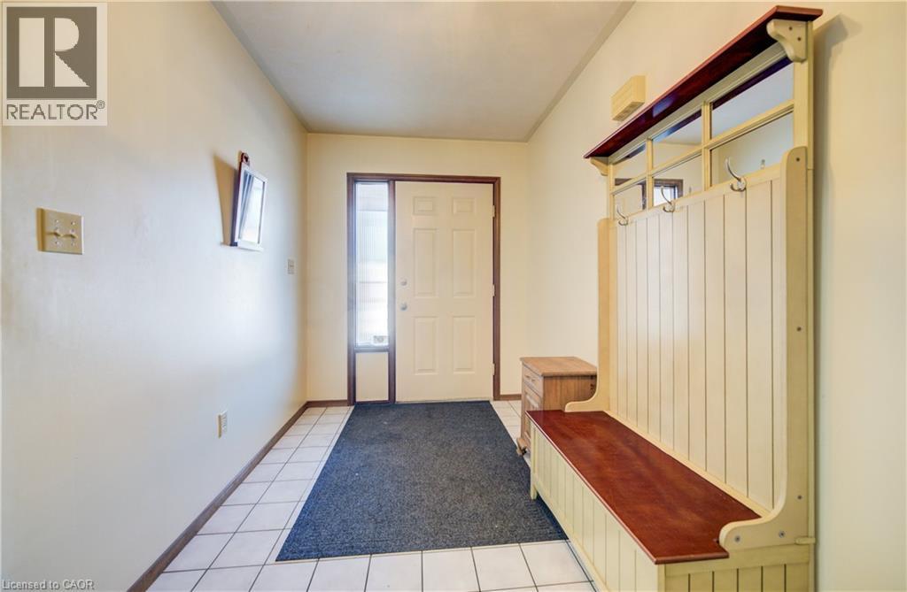 Mudroom featuring light tile patterned flooring and baseboards - 42 Ruffian Road, Brantford, ON - Indoor Photo Showing Other Room