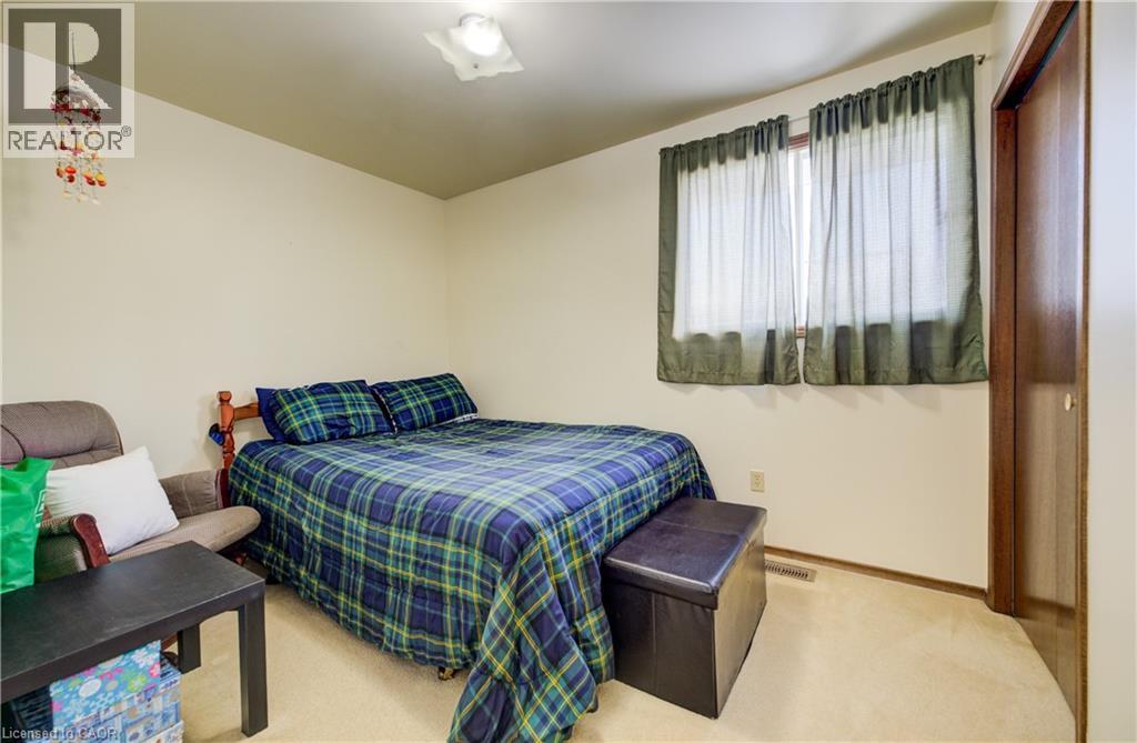 Bedroom 3 with light colored carpet - 42 Ruffian Road, Brantford, ON - Indoor Photo Showing Bedroom