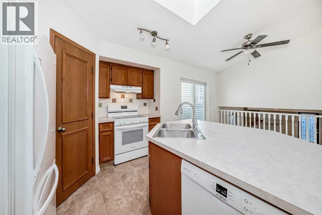 9875 Hidden Valley Drive Nw, Calgary, AB - Indoor Photo Showing Kitchen With Double Sink