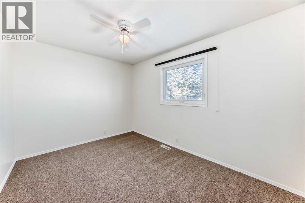 Bedroom 2 - 9875 Hidden Valley Drive Nw, Calgary, AB - Indoor Photo Showing Other Room