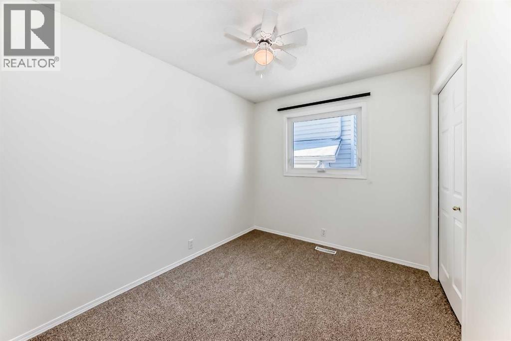 Bedroom 3 - 9875 Hidden Valley Drive Nw, Calgary, AB - Indoor Photo Showing Other Room
