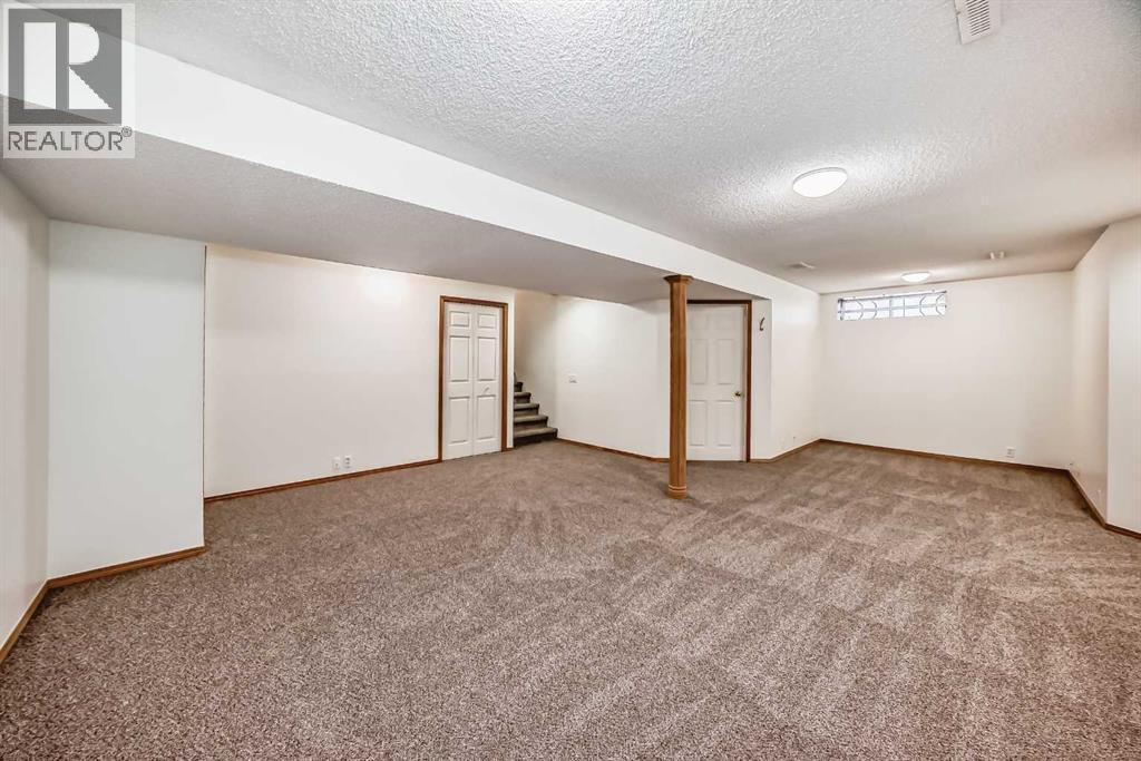 Basement Rec Area - 9875 Hidden Valley Drive Nw, Calgary, AB - Indoor Photo Showing Other Room
