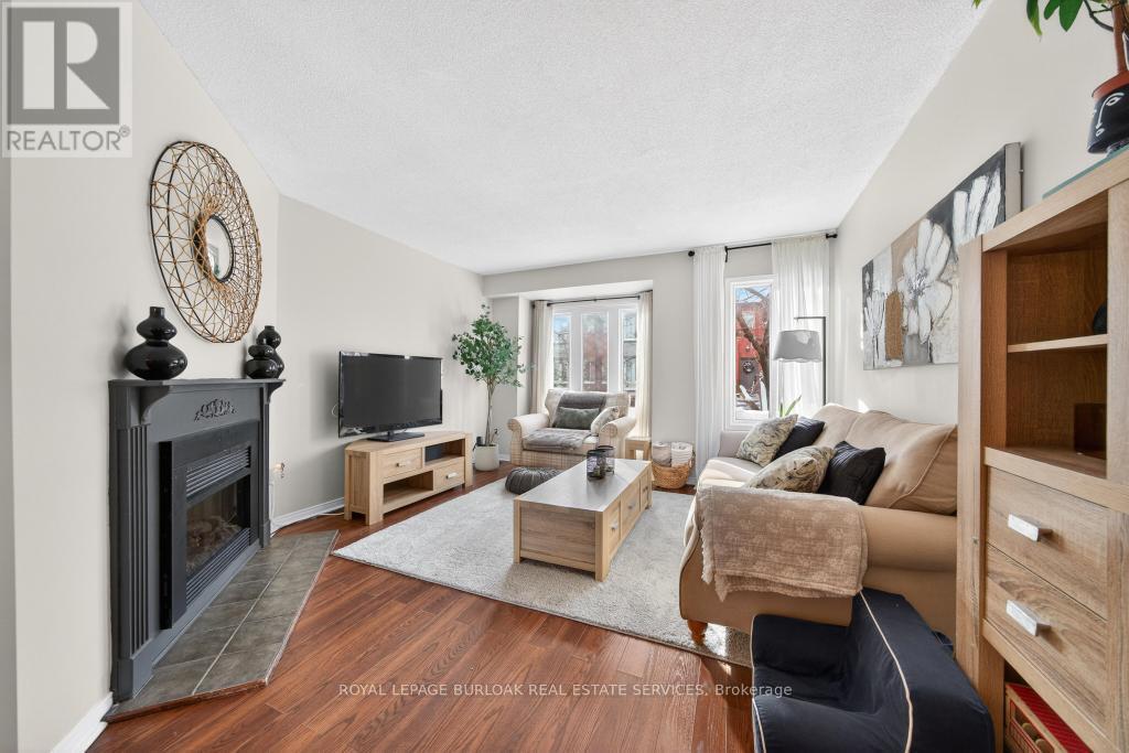 702 - 895 Maple Avenue, Burlington, ON - Indoor Photo Showing Living Room With Fireplace