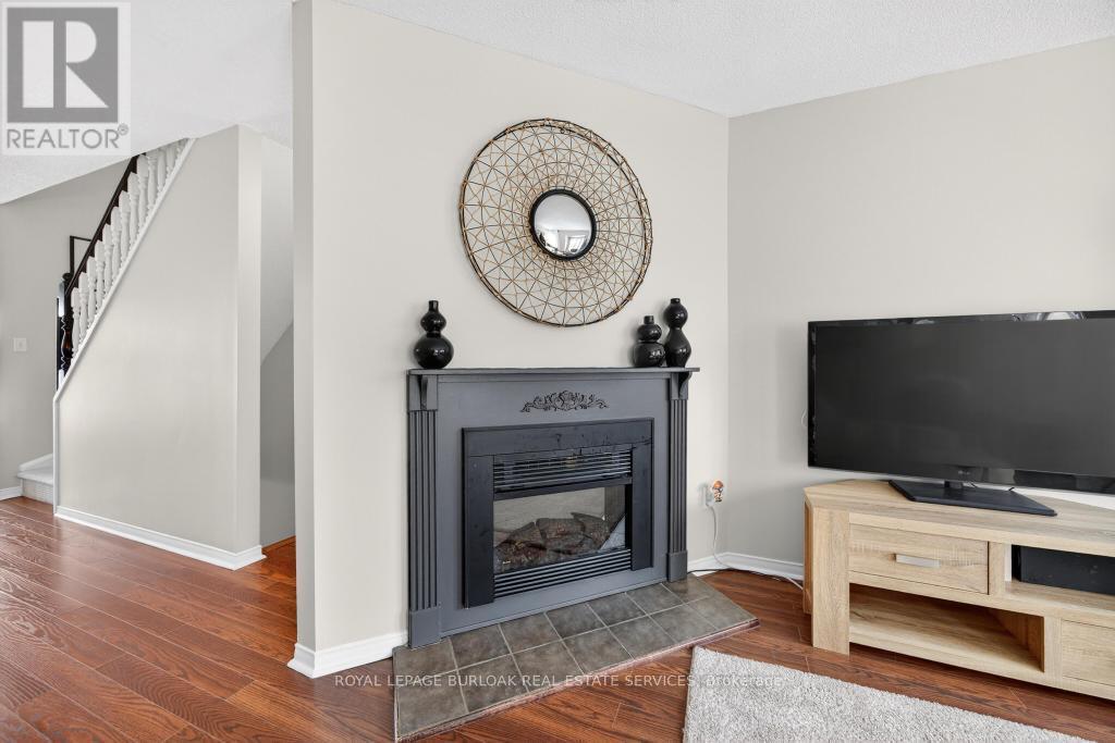 702 - 895 Maple Avenue, Burlington, ON - Indoor Photo Showing Living Room With Fireplace