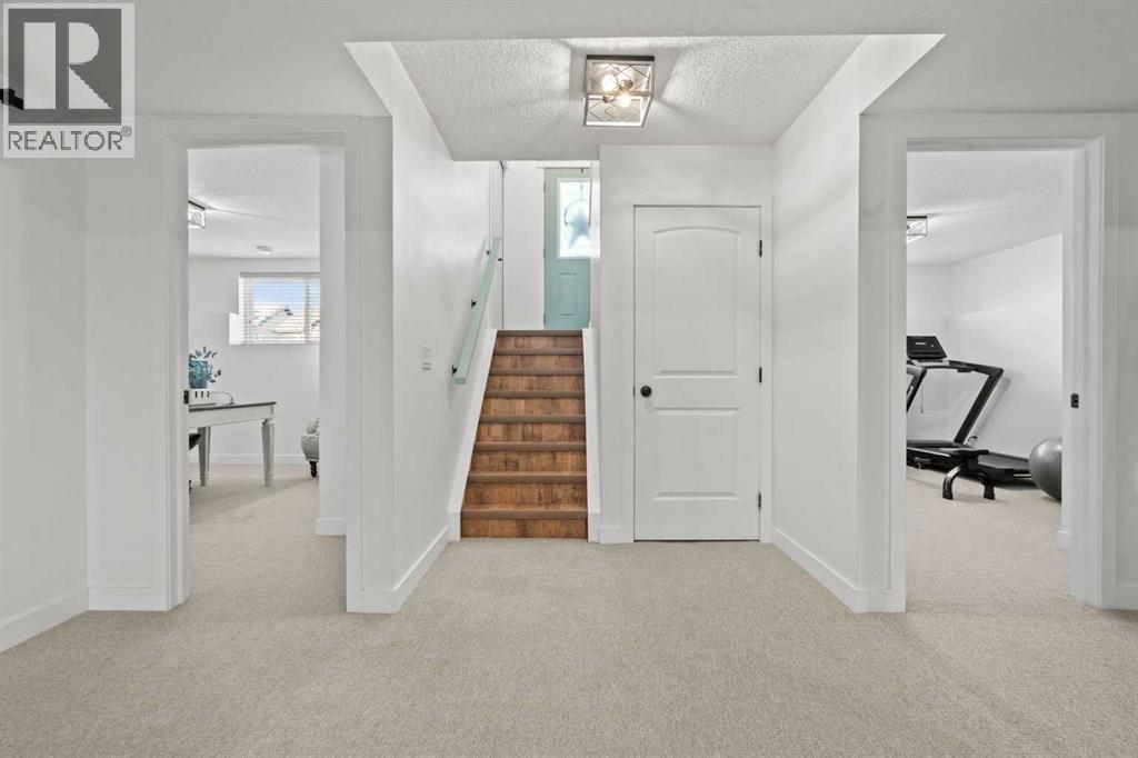 Fully developed basement - 311 Mcleod Crescent, Diamond Valley, AB - Indoor Photo Showing Other Room