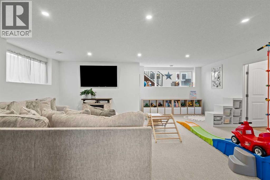 Downstairs living room - 311 Mcleod Crescent, Diamond Valley, AB - Indoor