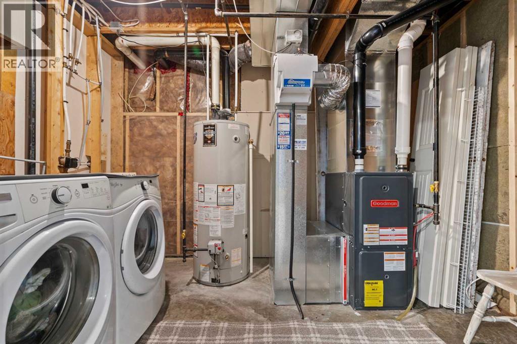 Laundry and Utility - 311 Mcleod Crescent, Diamond Valley, AB - Indoor Photo Showing Laundry Room