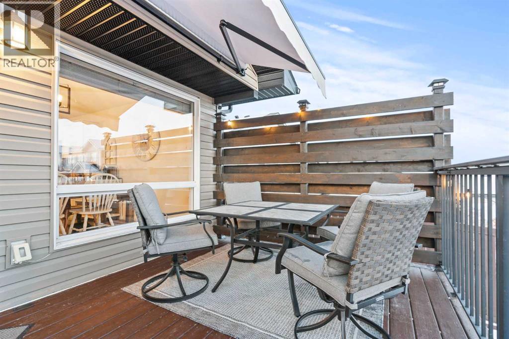 Back Balcony off Kitchen - 311 Mcleod Crescent, Diamond Valley, AB - Outdoor With Deck Patio Veranda With Exterior