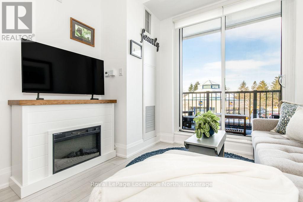 219 - 1 Hume Street, Collingwood, ON - Indoor Photo Showing Living Room With Fireplace
