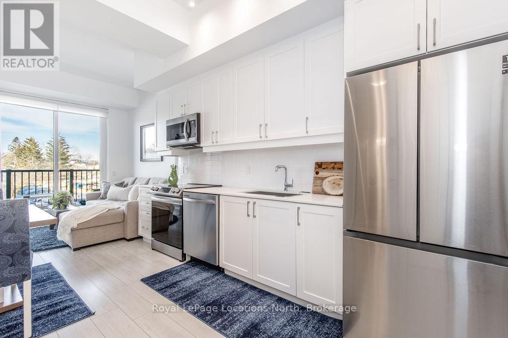219 - 1 Hume Street, Collingwood, ON - Indoor Photo Showing Kitchen With Stainless Steel Kitchen