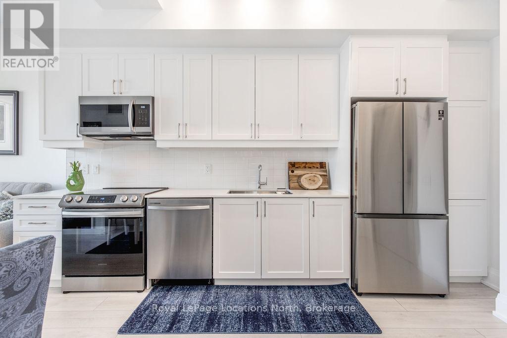 219 - 1 Hume Street, Collingwood, ON - Indoor Photo Showing Kitchen With Stainless Steel Kitchen