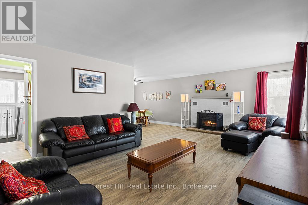 Front porch opens to Living Room - 58 Edith Avenue, Grey Highlands, ON - Indoor Photo Showing Living Room With Fireplace