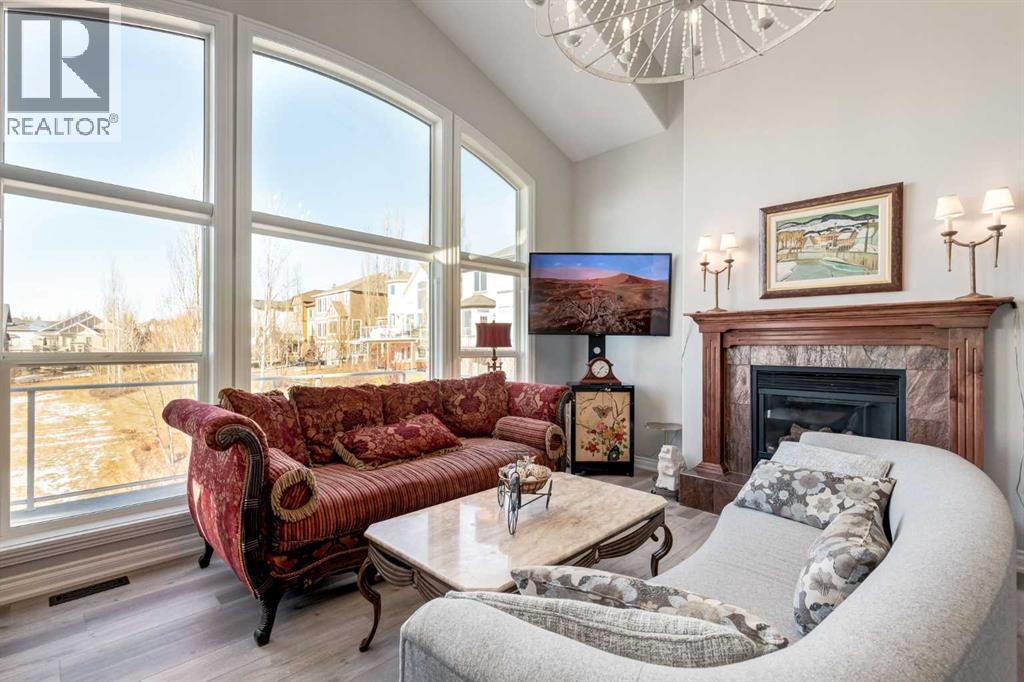 79 Discovery Ridge Park Sw, Calgary, AB - Indoor Photo Showing Living Room With Fireplace