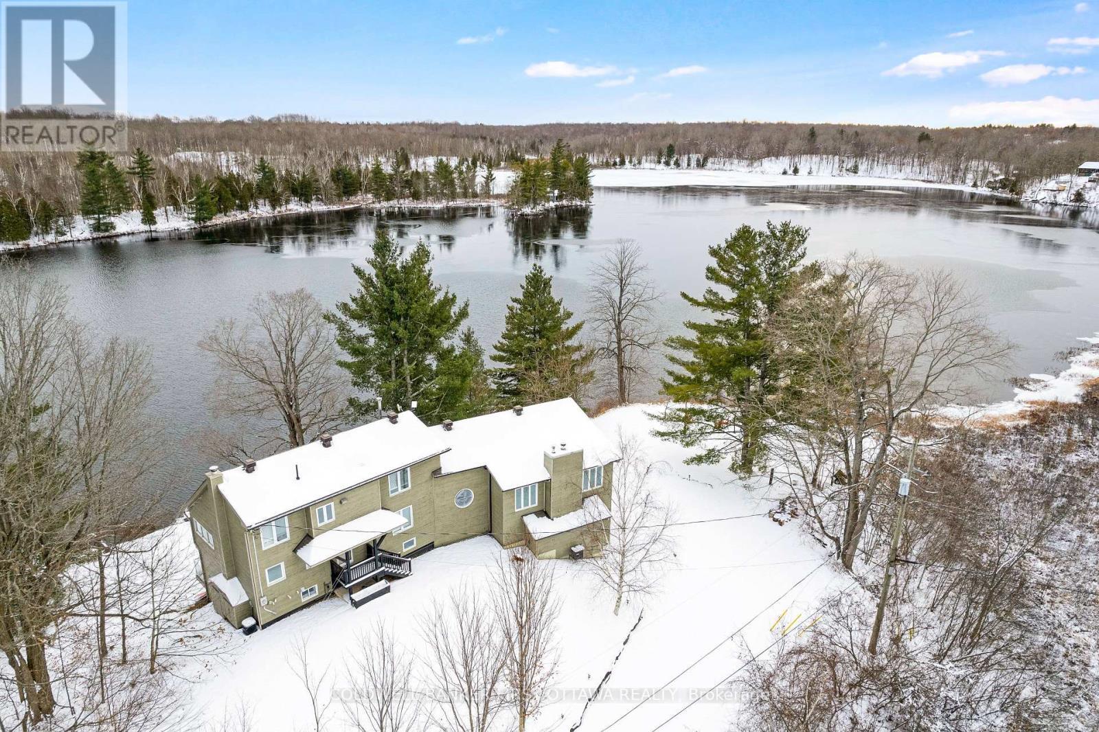 Views of both sunrises & sunsets over the lake - 100 Nagle Way, Tay Valley, ON - Outdoor With Body Of Water With View