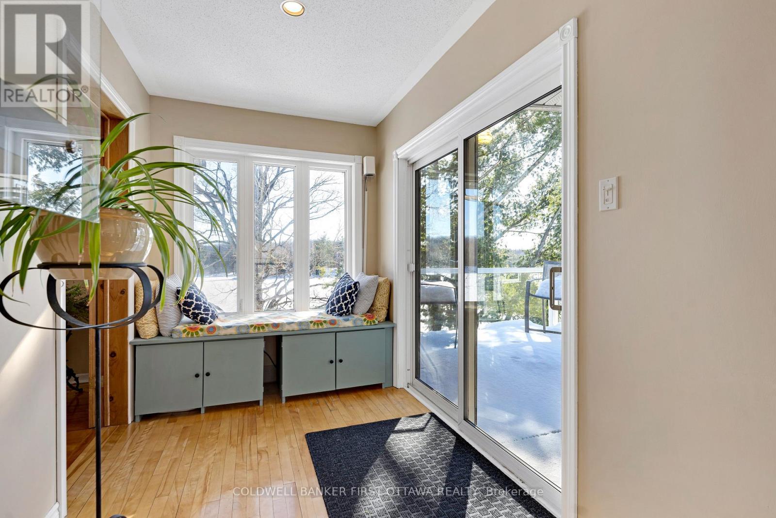 Patios door to deck - 100 Nagle Way, Tay Valley, ON - Indoor Photo Showing Other Room
