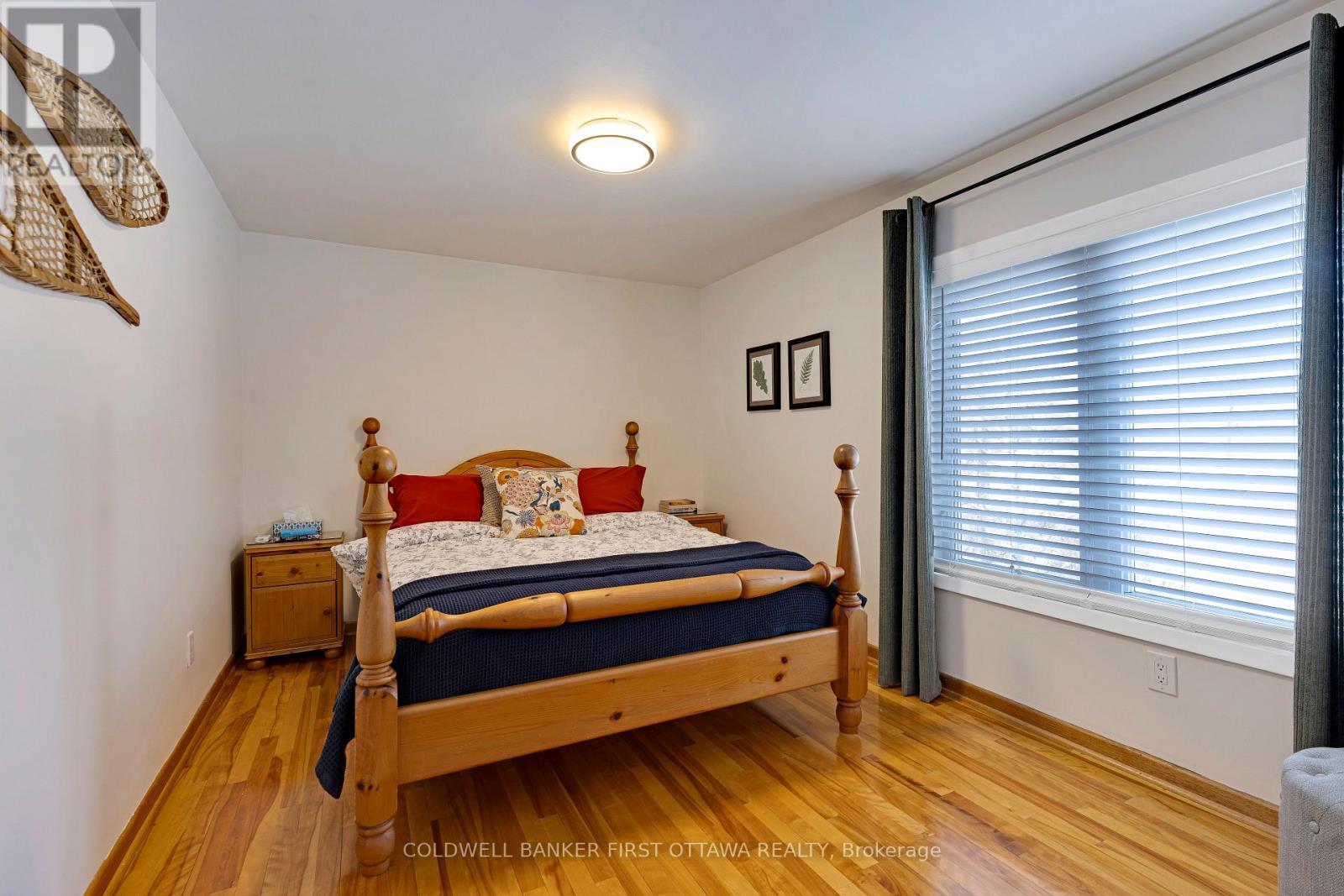 Main floor bedroom - possible as primary bedrm - 100 Nagle Way, Tay Valley, ON - Indoor Photo Showing Bedroom