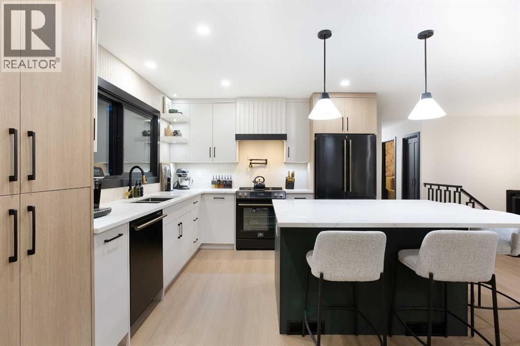 2416 Palliser Drive Sw, Calgary, AB - Indoor Photo Showing Kitchen With Upgraded Kitchen