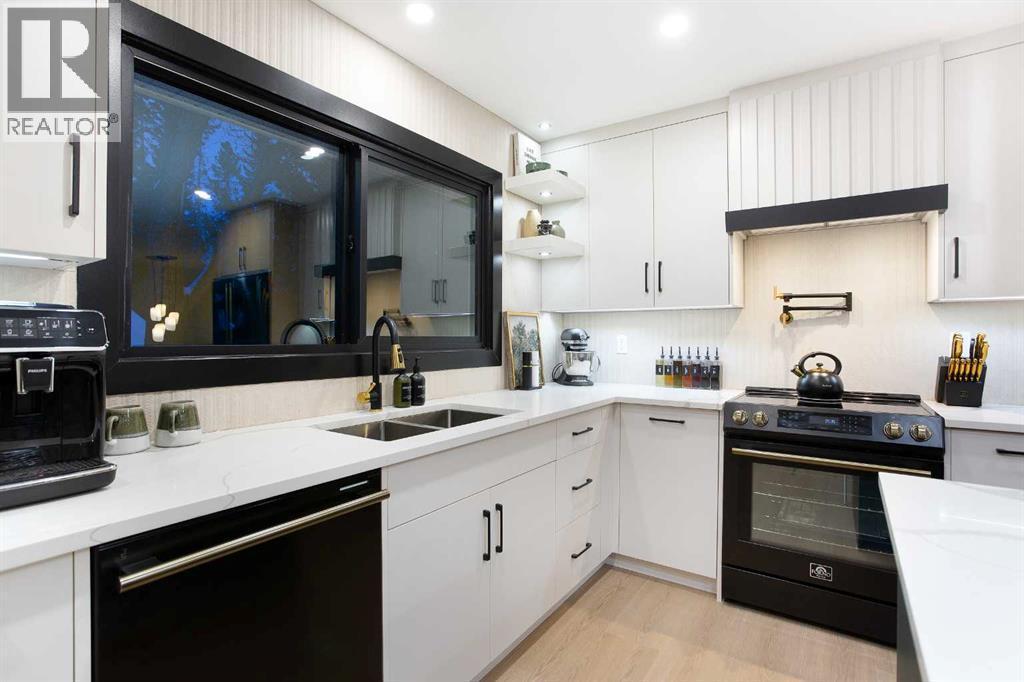 2416 Palliser Drive Sw, Calgary, AB - Indoor Photo Showing Kitchen With Double Sink With Upgraded Kitchen