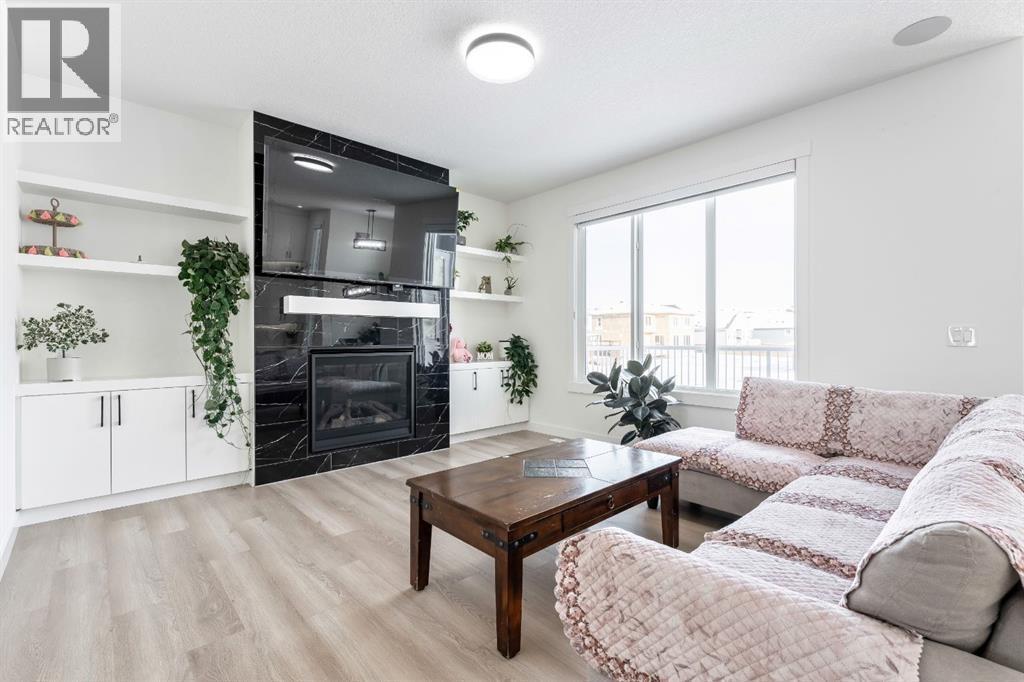 Beautiful Gas Fireplace - 27 Bridges Drive, Langdon, AB - Indoor Photo Showing Living Room With Fireplace