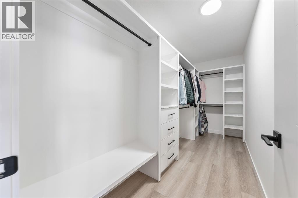 Large closet - 27 Bridges Drive, Langdon, AB - Indoor With Storage