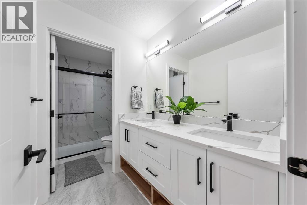Kids 4 Piece Bath with Privacy Door to Toilet & Shower - 27 Bridges Drive, Langdon, AB - Indoor Photo Showing Bathroom