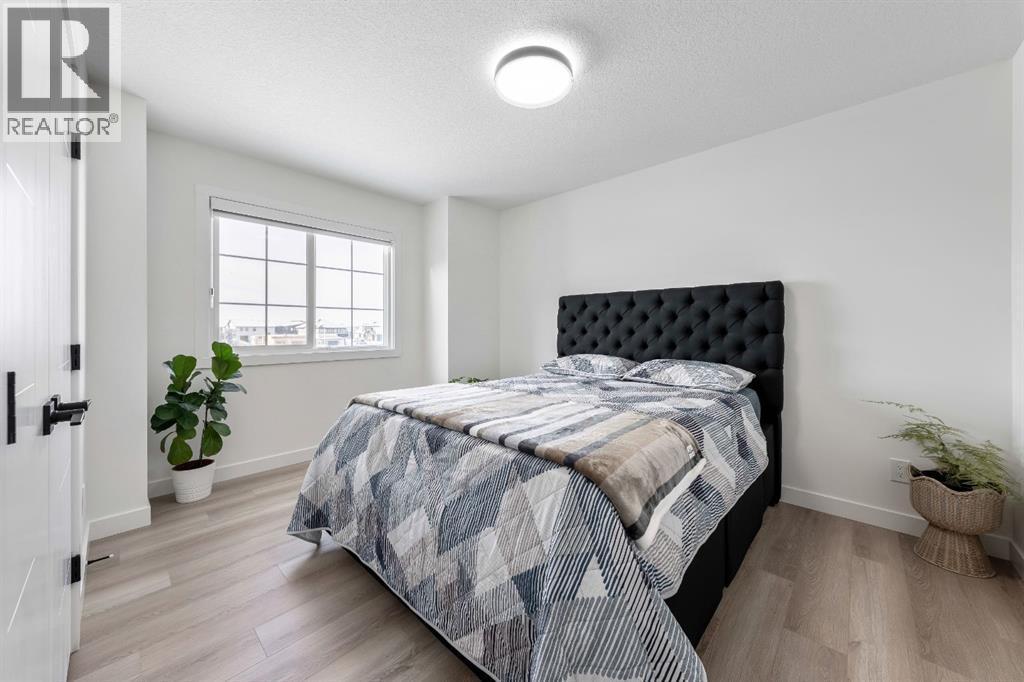 27 Bridges Drive, Langdon, AB - Indoor Photo Showing Bedroom