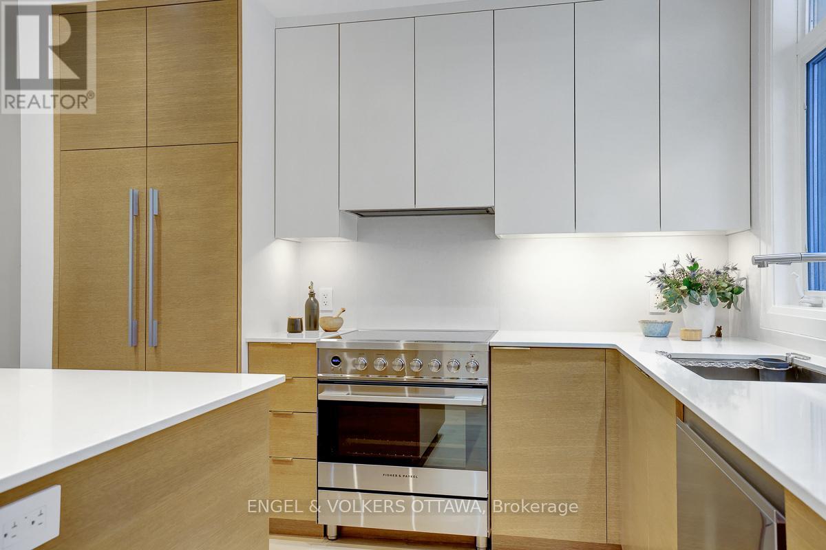 Fisher Payke induction range & integrated hood - 449 Edison Avenue, Ottawa, ON - Indoor Photo Showing Kitchen With Double Sink With Upgraded Kitchen